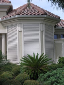 Hurricane shutters protecting the windows of a Florida home.