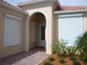 Picture of hurricane shutters on the front of a house.