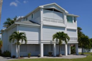 Picture of a coastal home outfitted with hurricane shutters.