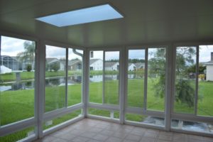 Picture of the interior of a newly installed sunroom addition with a skylight.