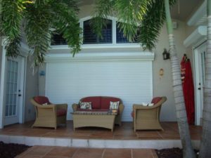 Roll down shutters over a patio doors at a Florida home.
