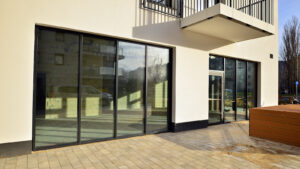 Panoramic windows of commercial property with storefront windows.