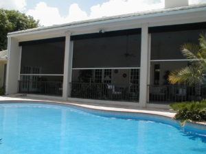 Large residential property with security screens installed over the outdoor patio.